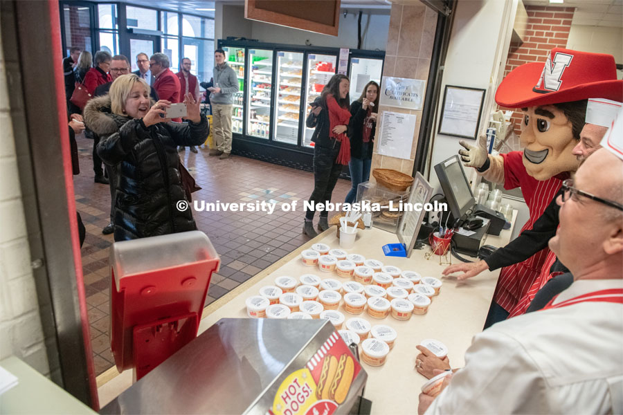 Donde Plowman takes a picture of the East Campus Administration who were serving up ice cream for the Charter Day open house at the Dairy Store on East Campus. A special N150 ice cream flavor Nifty 150 was served as part of N150's Charter Week celebration. February 15, 2019. Photo by Gregory Nathan / University Communication.